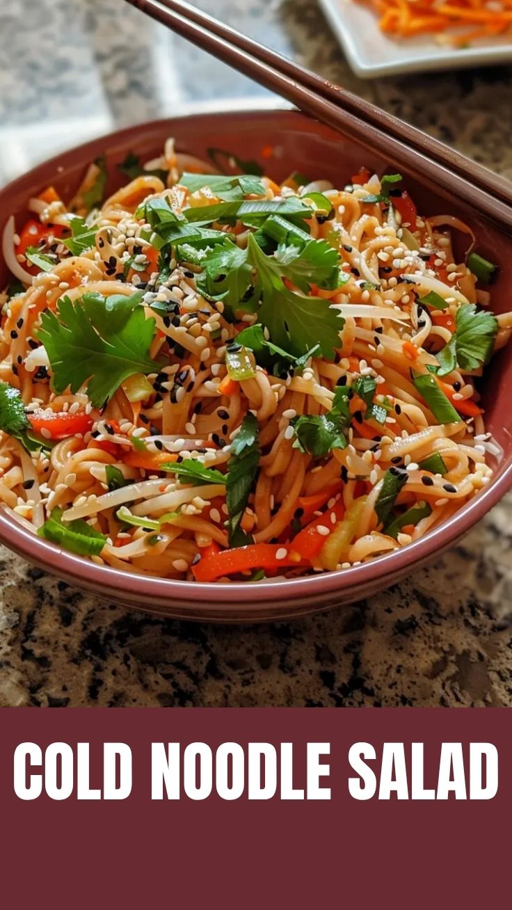 Vibrant bowl of Cold Noodle Salad Asian-style with colorful vegetables and sesame seeds