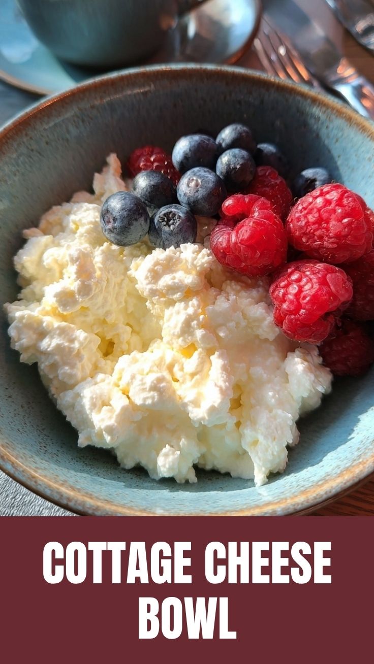 A high protein cottage cheese bowl topped with various fresh fruits and nuts.