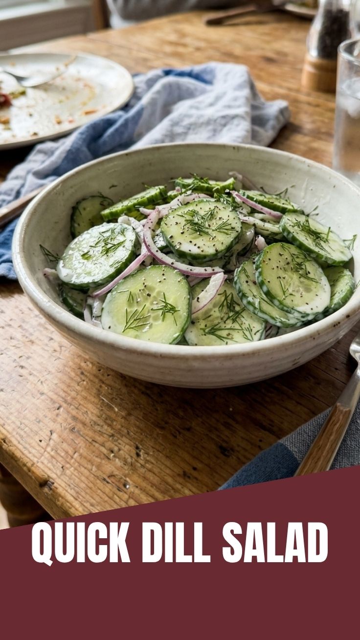 A refreshing cucumber dill salad in a white bowl with fresh ingredients.