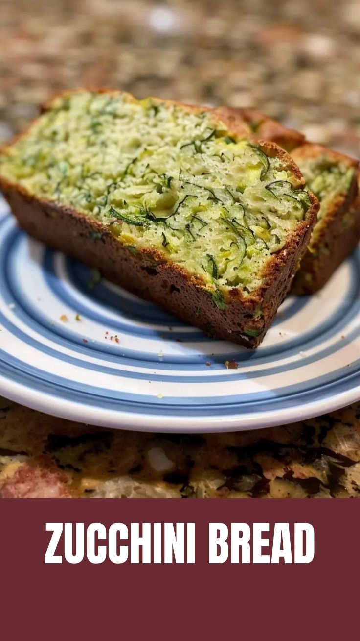 A freshly baked loaf of zucchini bread, golden brown and inviting.