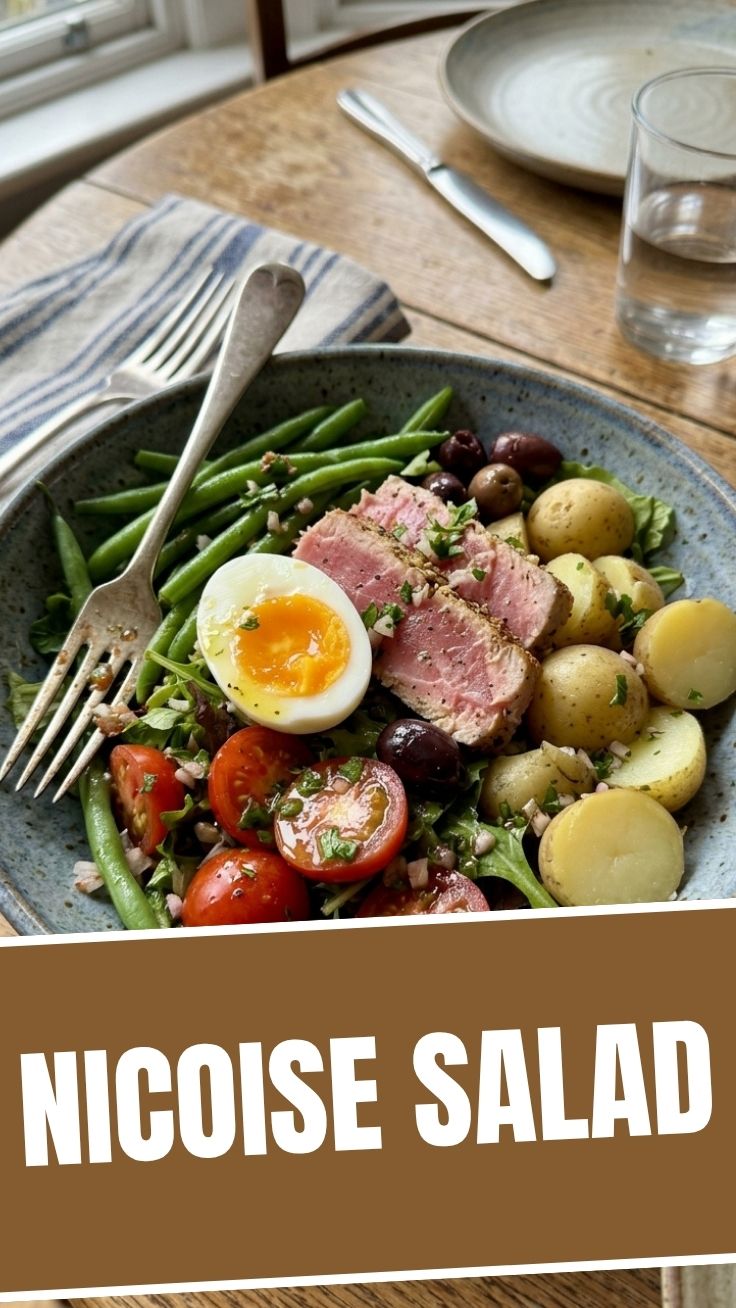 A fresh Nicoise salad with tuna, olives, green beans, and hard-boiled eggs