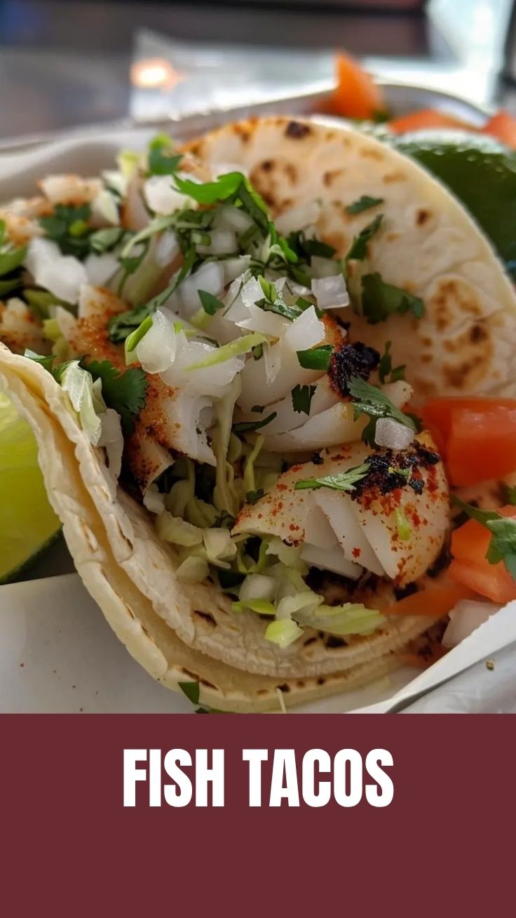 Golden crispy fish taco with slaw and avocado on a wooden board