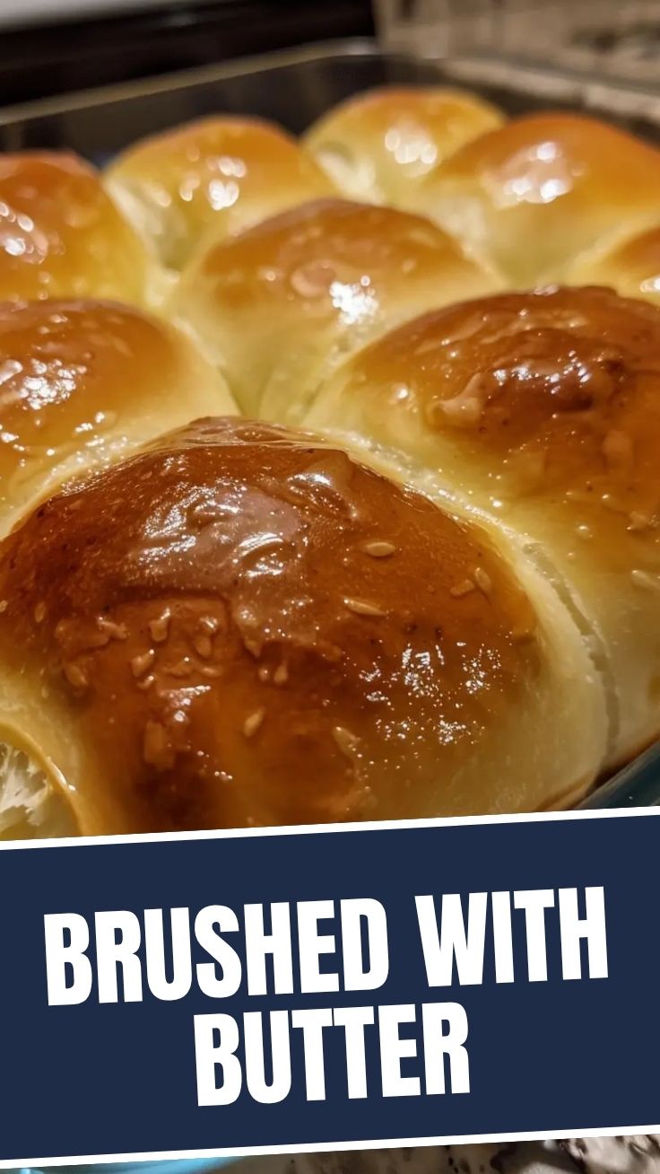 Soft dinner rolls with a golden-brown top, fresh from the oven.