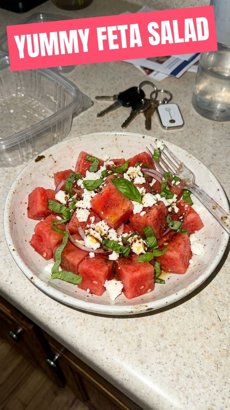 Healthy watermelon feta salad in a white bowl with mint garnish