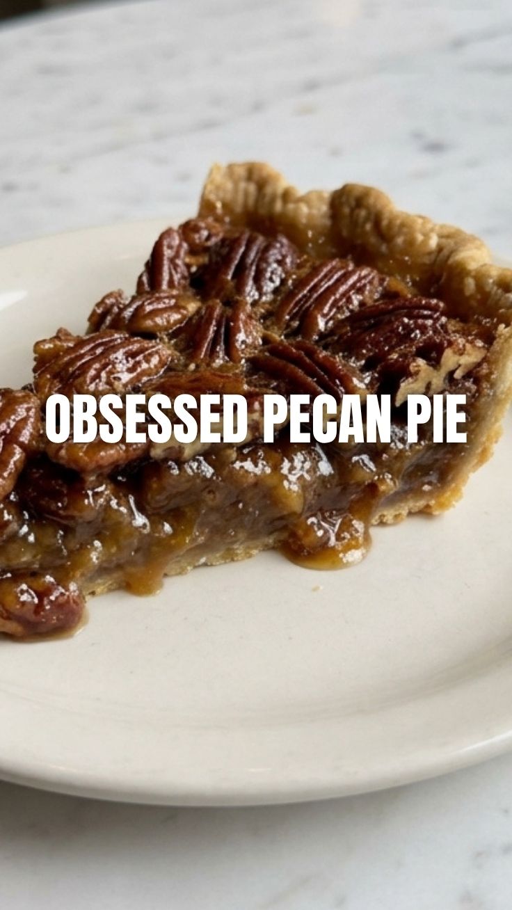 A freshly baked pecan pie with a golden-brown crust and glistening nutty filling.