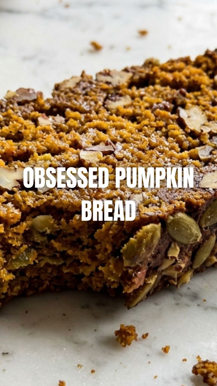 Moist pumpkin bread on a cooling rack with cinnamon sticks