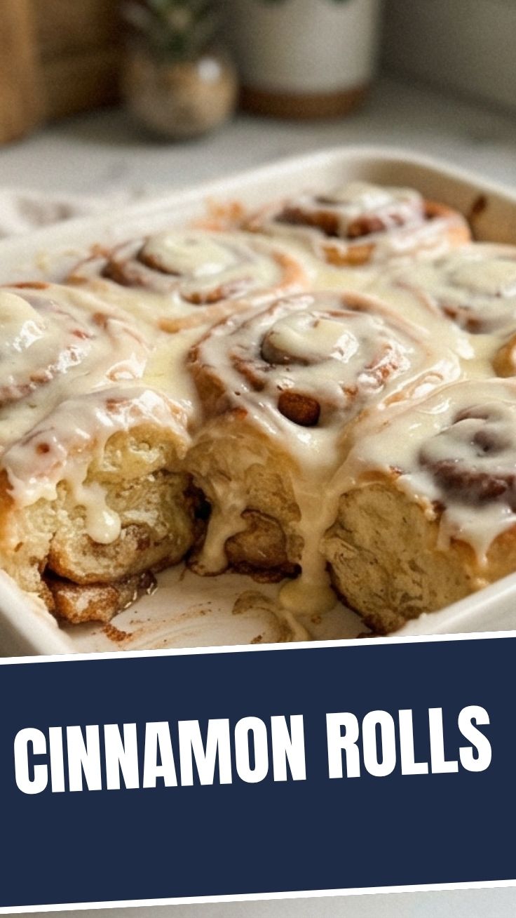 Platter of freshly baked cinnamon rolls with white icing
